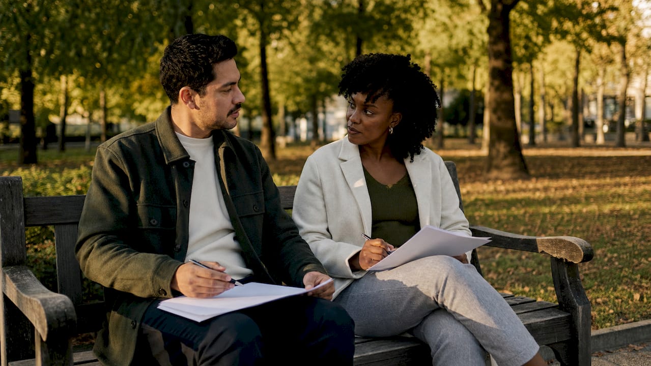 Couple discussing no-fault divorce documents together